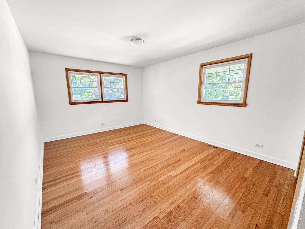 15831 Trumbull Avenue Markham, IL 60428 - Photo 13 of 25 a view of empty room with wooden floor