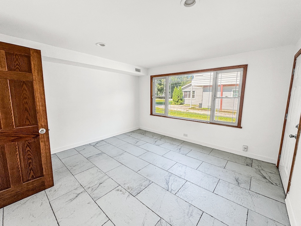 15831 Trumbull Avenue Markham, IL 60428 - Photo 16 of 25 a view of an empty room with a window