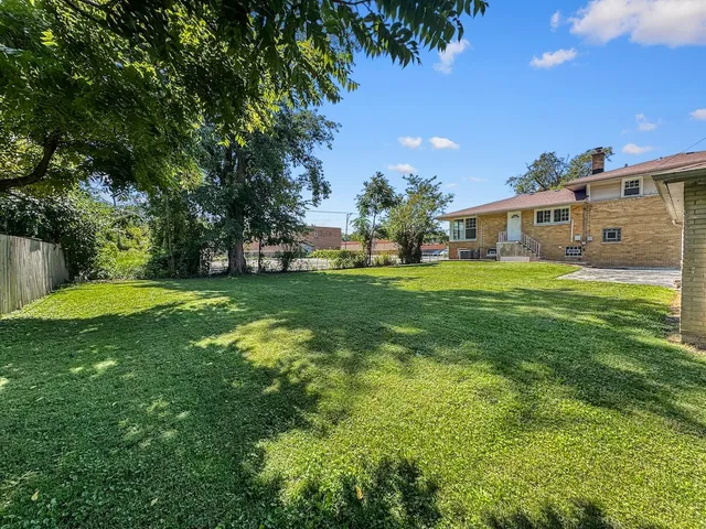 a view of a house with a big yard