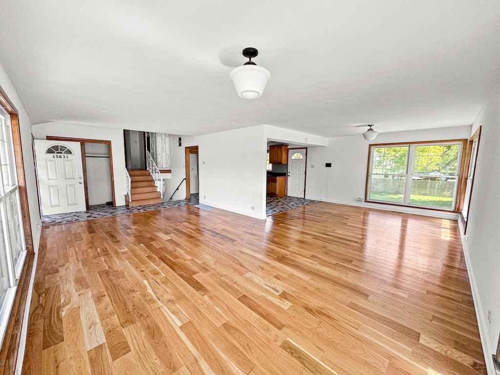15831 Trumbull Avenue Markham, IL 60428 - Photo 6 of 25 a view of empty room with wooden floor and fan