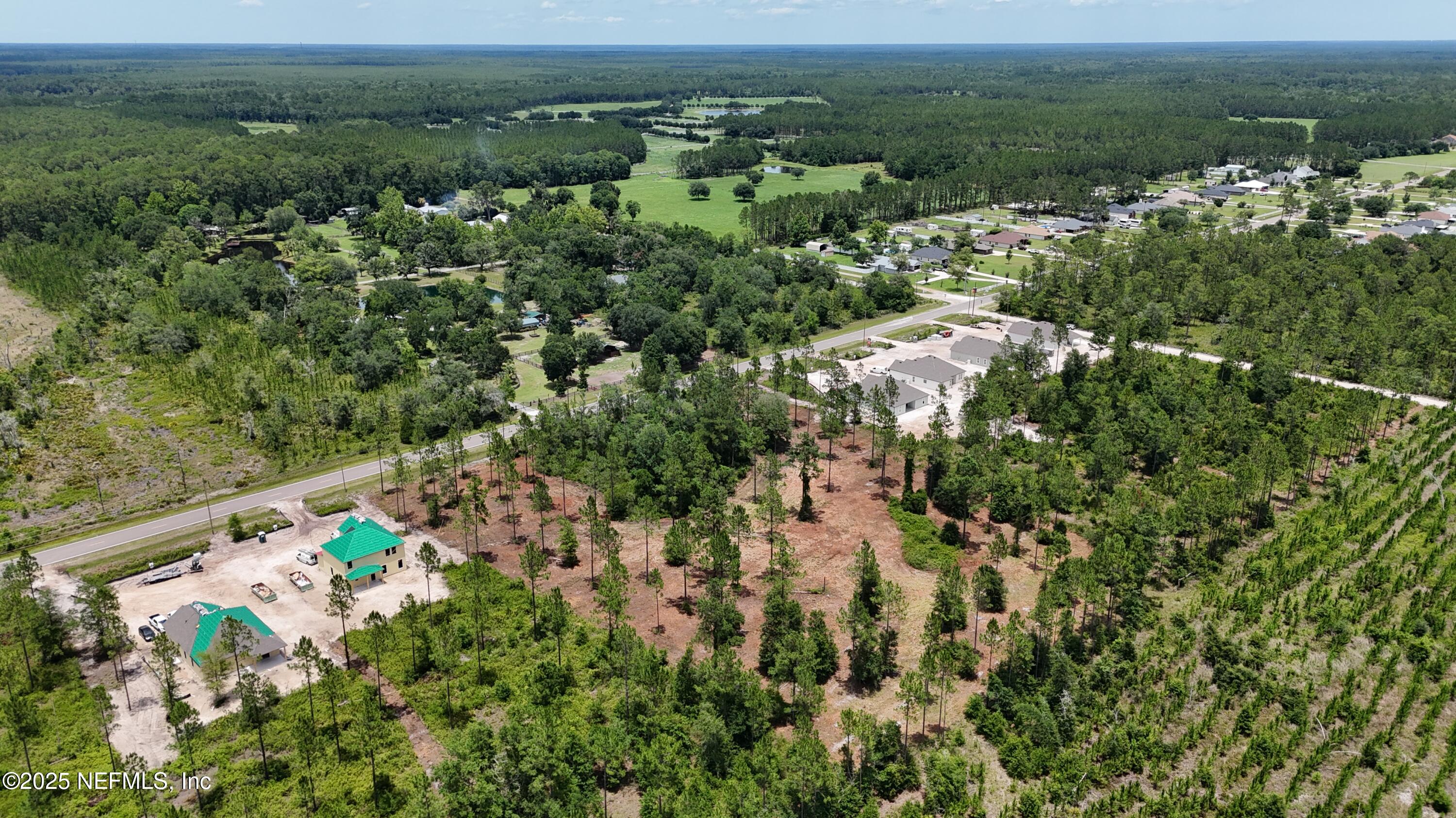 8815 Ford Road Bryceville, FL 32009 - Photo 5 of 9 an aerial view of a houses with a yard