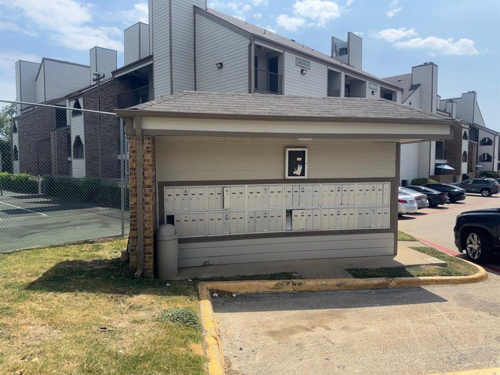 6108 Abrams Road, Unit 103 Dallas, TX 75231 - Photo 16 of 17 a view of a house with a garage