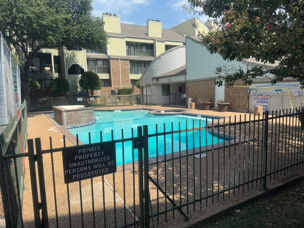 6108 Abrams Road, Unit 103 Dallas, TX 75231 - Photo 17 of 17 a view of a house with backyard and porch
