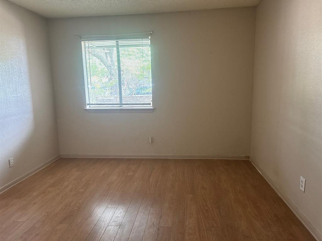 6108 Abrams Road, Unit 103 Dallas, TX 75231 - Photo 8 of 17 an empty room with a window