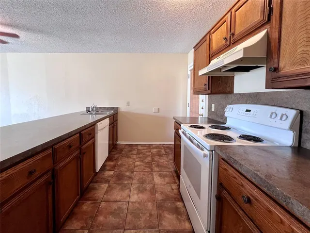 a kitchen with a stove and a sink