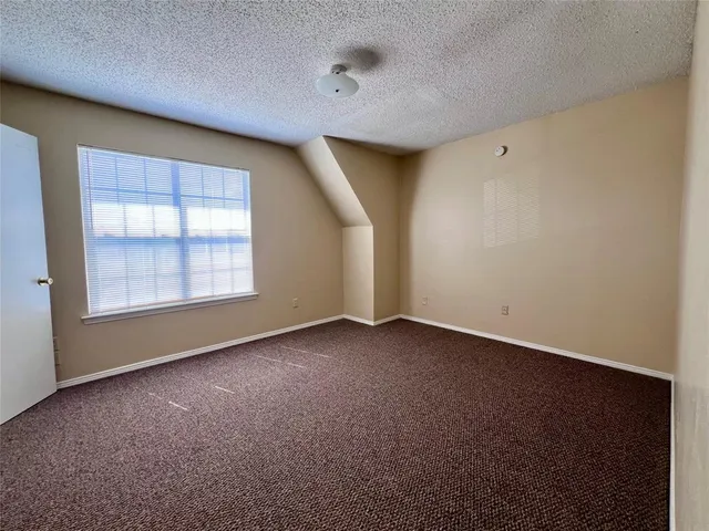 an empty room with a empty space and windows
