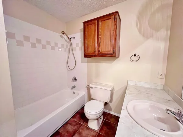 a bathroom with a toilet and a bathtub