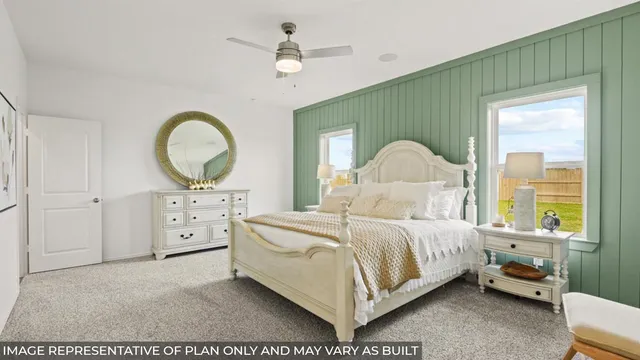 a bedroom with a bed window and a chair