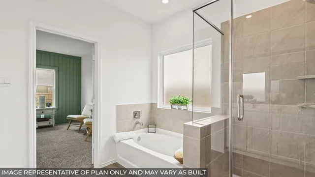 a en suite bathroom with a double vanity sink and a mirror