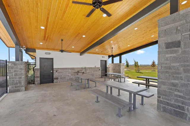 a view of a swimming pool with an outdoor space and seating area