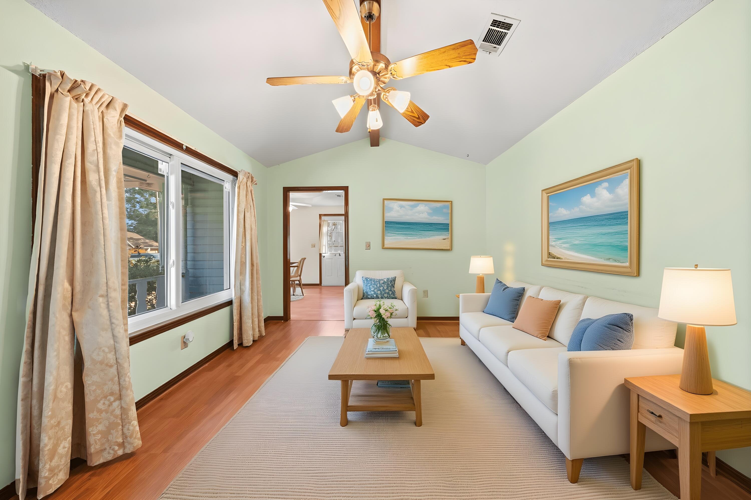 144 Oak Terrace Drive Crestview, FL 32539 - Photo 11 of 61 a living room with furniture a table and a potted plant