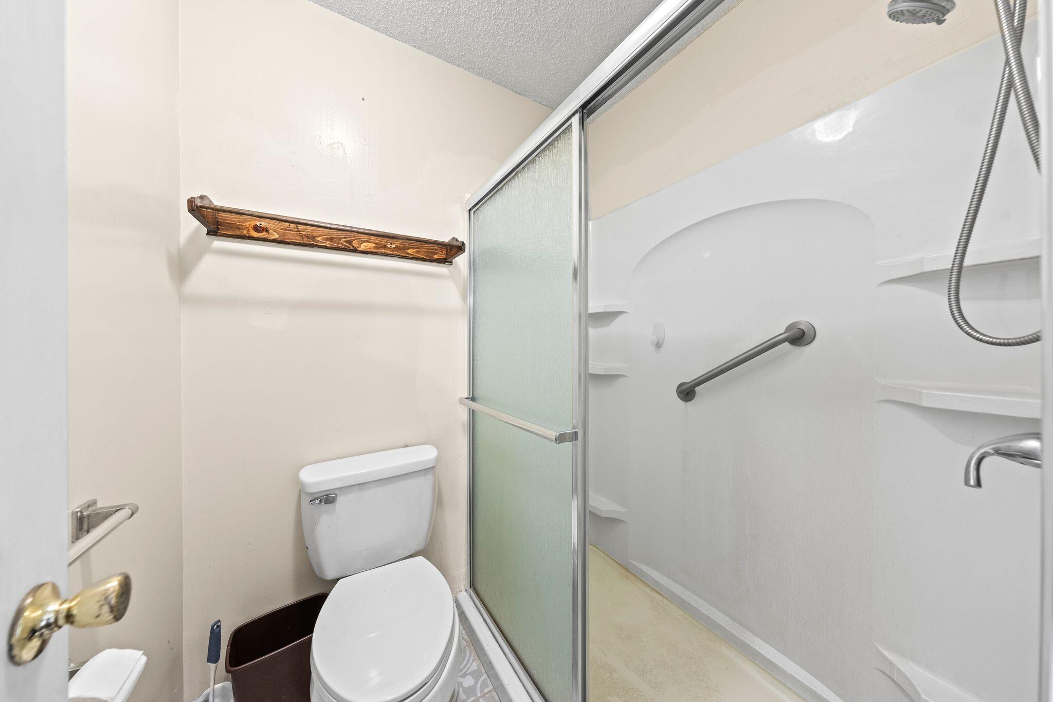 144 Oak Terrace Drive Crestview, FL 32539 - Photo 26 of 61 a white toilet sitting next to a bathroom sink