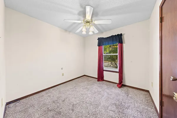 a view of a room with wooden walls