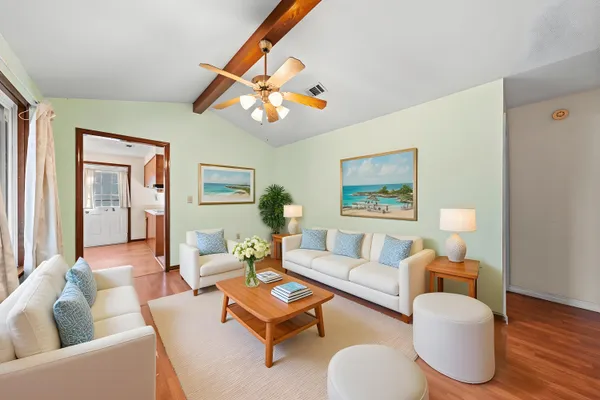 a living room with furniture and a large window