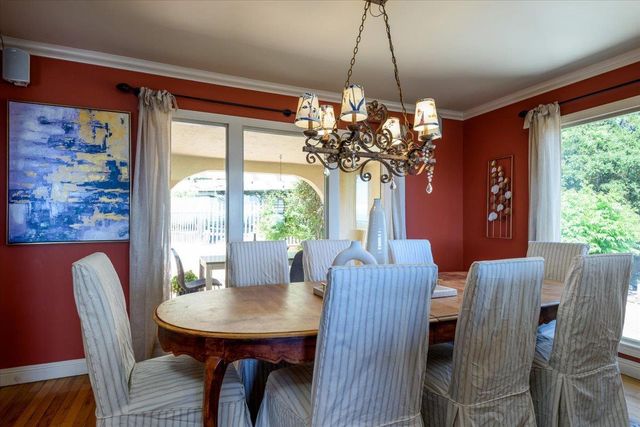 a view of a house with yard and sitting area
