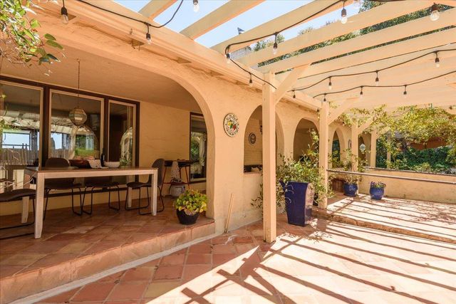 a bedroom with furniture and a flat screen tv