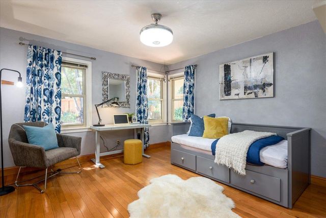 a bathroom with a sink and mirror with toilet