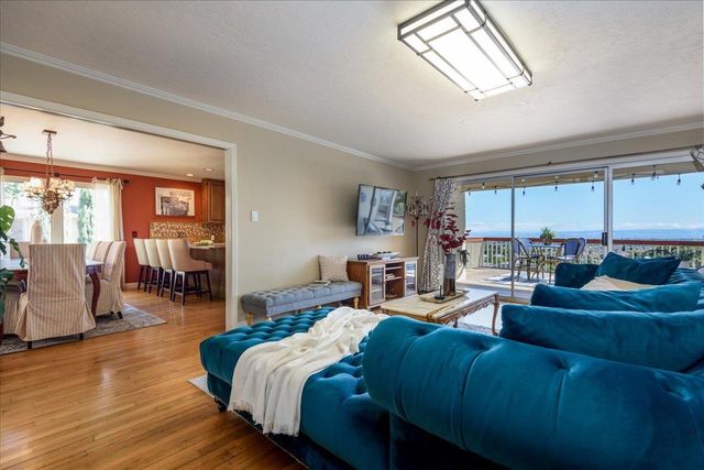 a kitchen with sink and large window