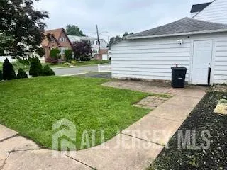 a view of a backyard with sitting area
