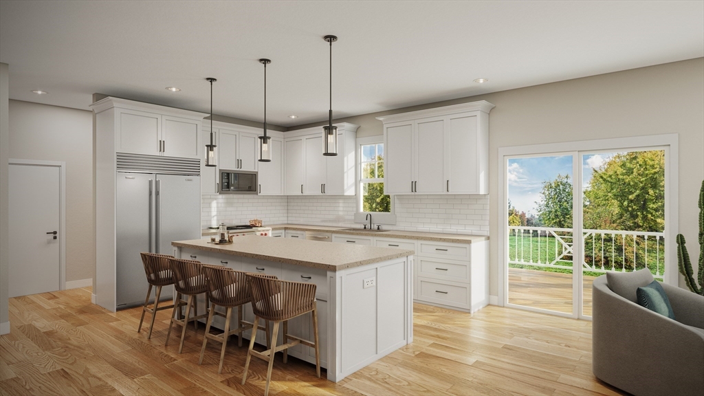 111 Squannacook Road Shirley, MA 01464 - Photo 2 of 22 a kitchen with kitchen island a stove a refrigerator a sink a dining table and chairs with wooden floor