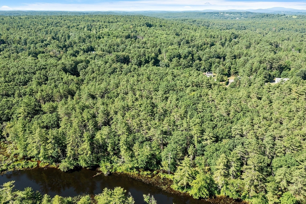 111 Squannacook Road Shirley, MA 01464 - Photo 8 of 22 a view of a lush green field