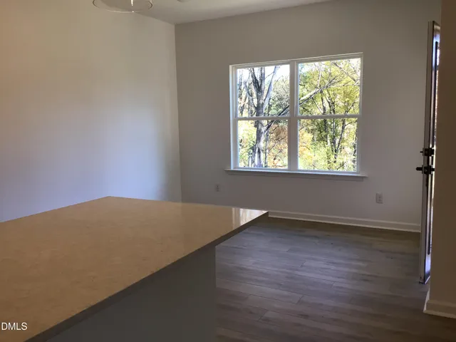 a view of a large window with wooden floor