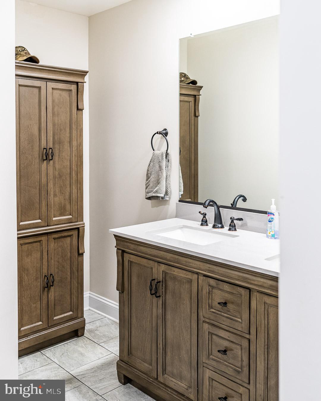625 Carson Road Huntingtown, MD 20639 - Photo 18 of 21 a bathroom with a sink and a mirror