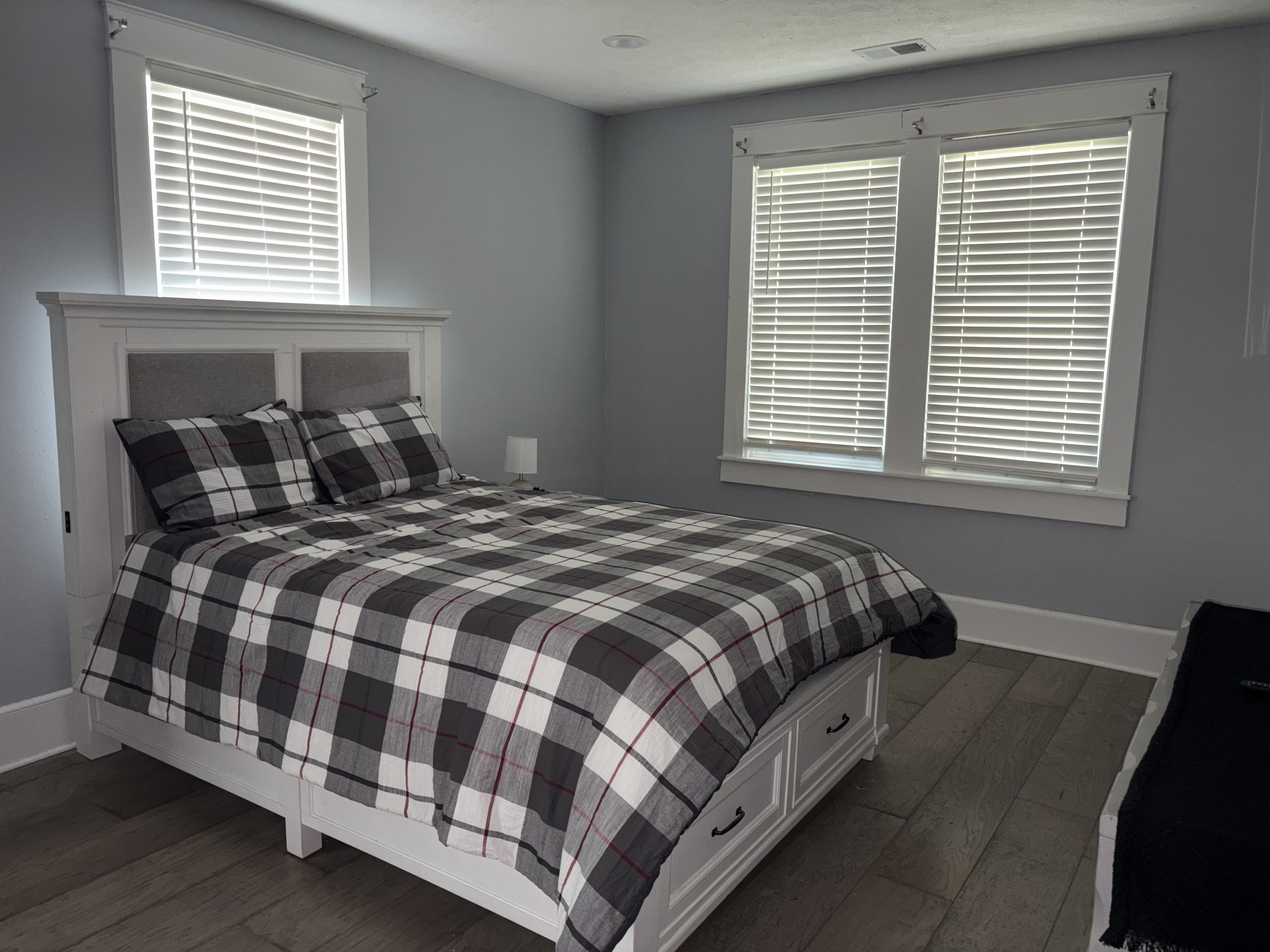 317 East Main Street Waverly, TN 37185 - Photo 3 of 9 a bed sitting in a bedroom next to a window