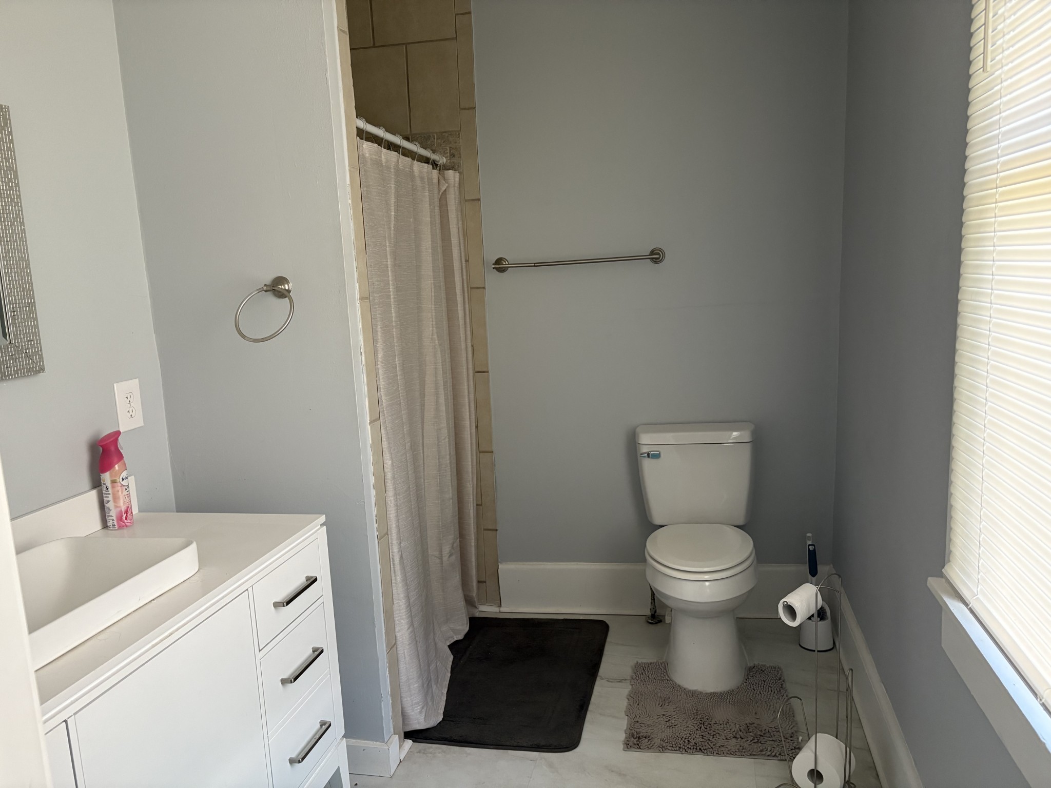 317 East Main Street Waverly, TN 37185 - Photo 4 of 9 a bathroom with a toilet sink and a window