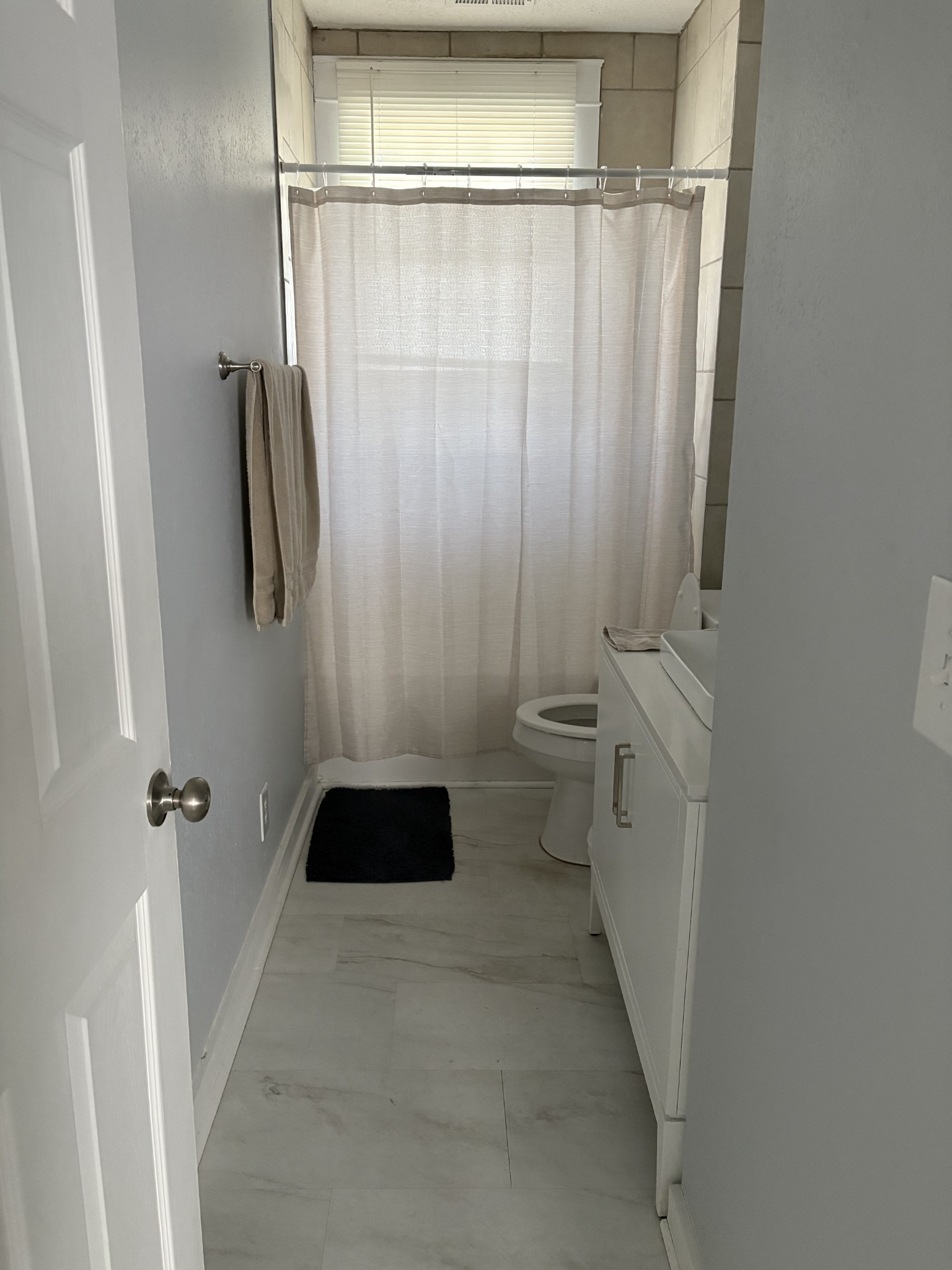 317 East Main Street Waverly, TN 37185 - Photo 6 of 9 a bathroom with a sink and a shower