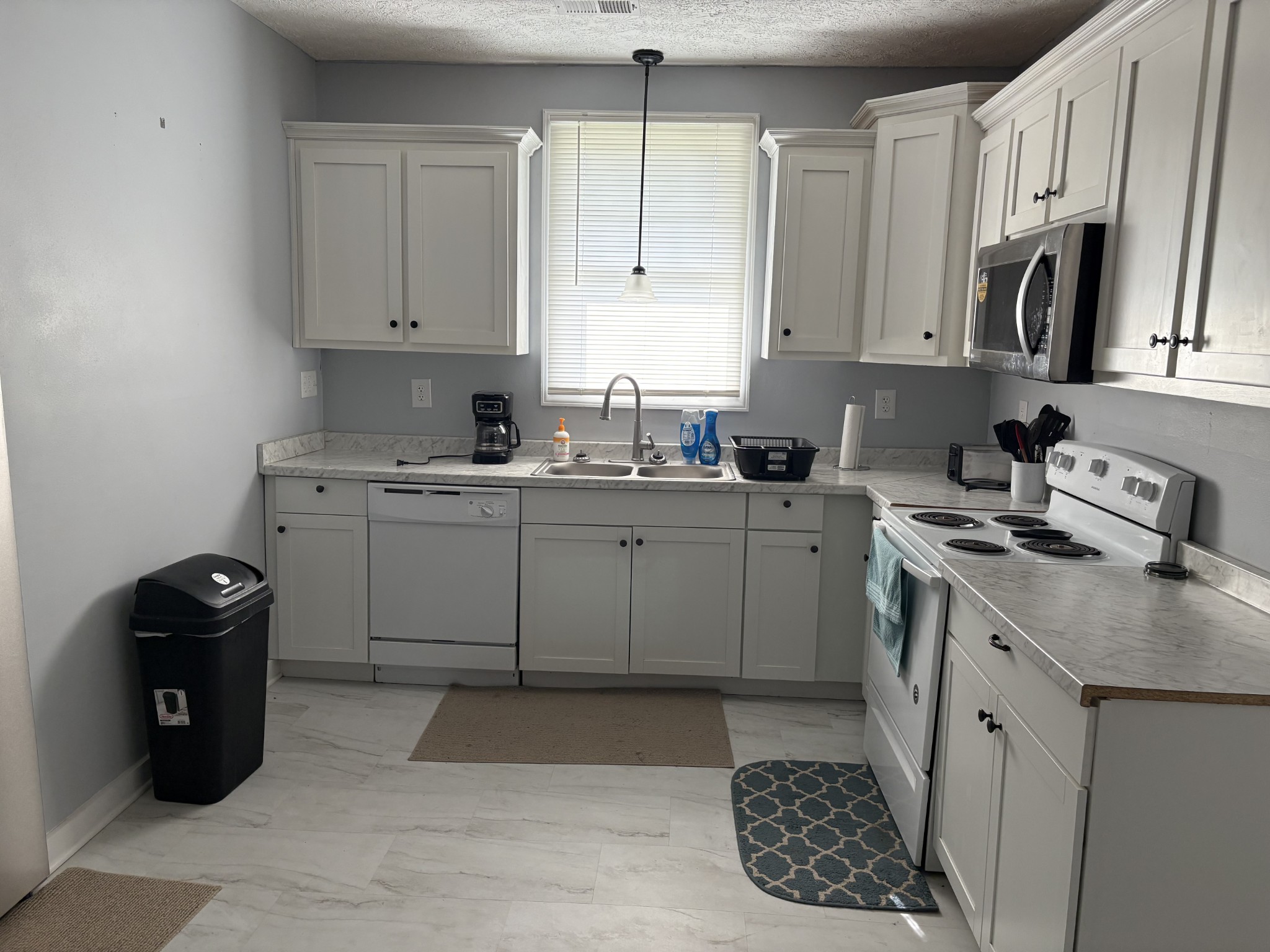 317 East Main Street Waverly, TN 37185 - Photo 9 of 9 a kitchen with a sink cabinets and window