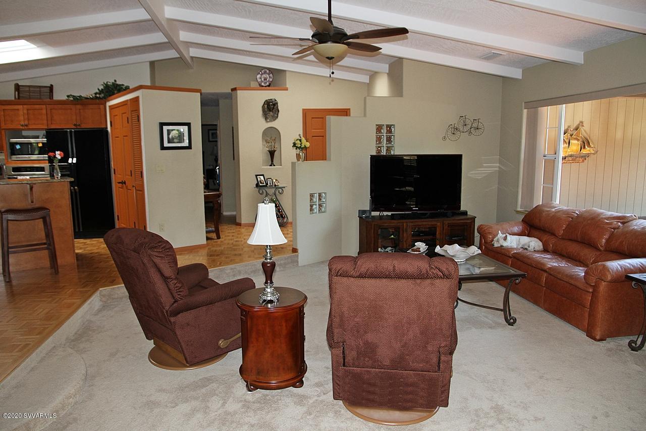 2275 Corral Road Sedona, AZ 86336 - Photo 20 of 30 a living room with furniture and a flat screen tv