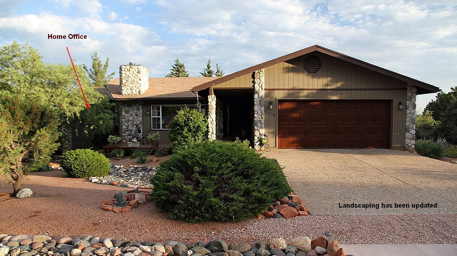 2275 Corral Road Sedona, AZ 86336 - Photo 2 of 30 a front view of a house with a yard