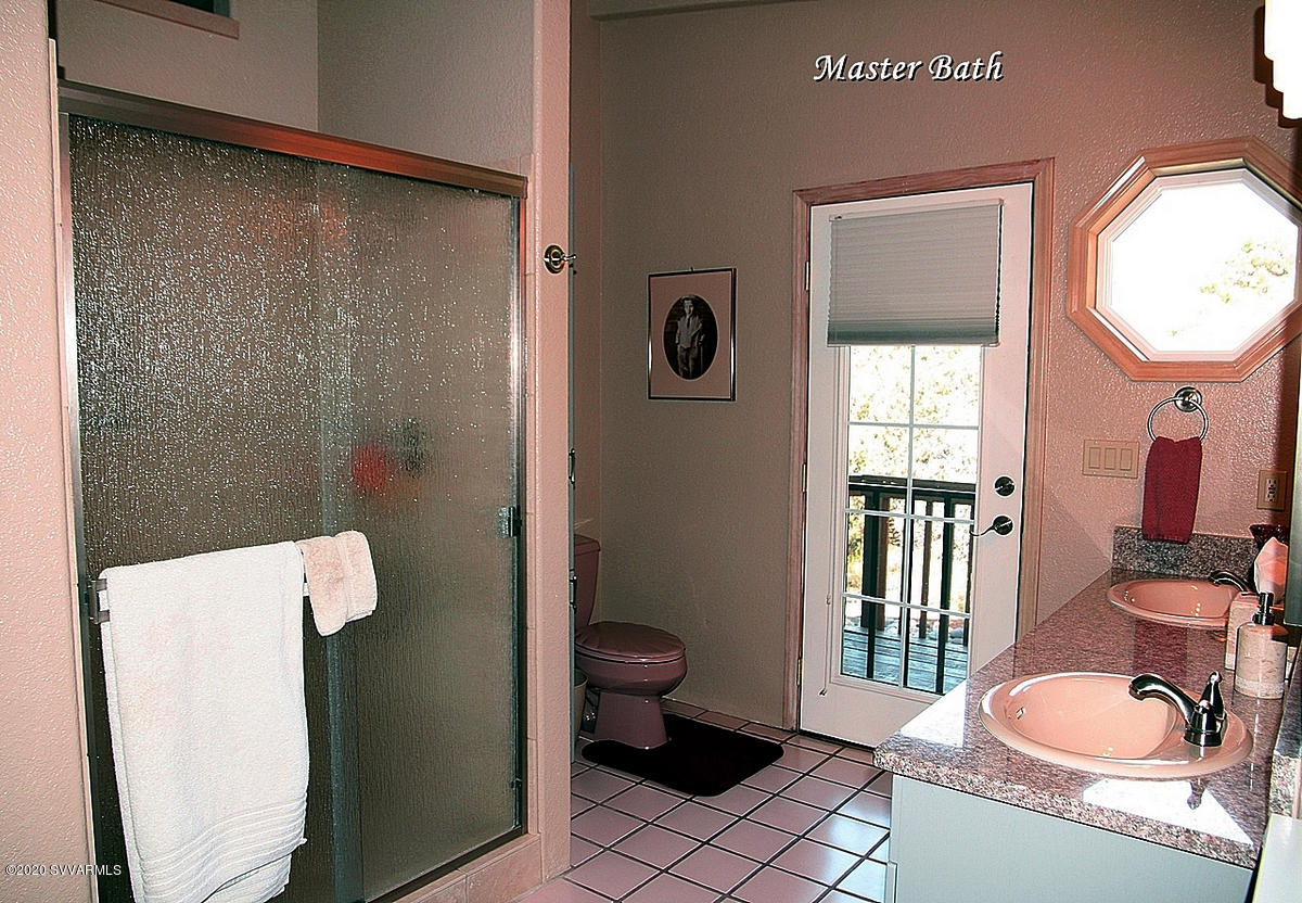 2275 Corral Road Sedona, AZ 86336 - Photo 24 of 30 a bathroom with a sink toilet and shower