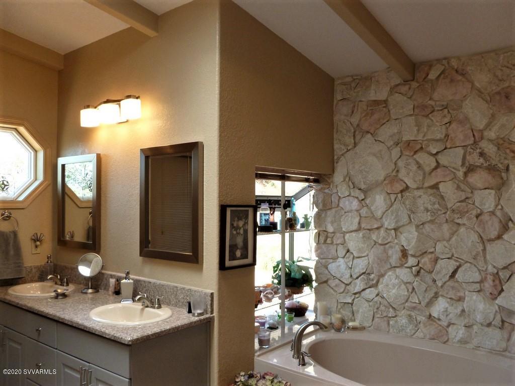 2275 Corral Road Sedona, AZ 86336 - Photo 25 of 30 a bathroom with a sink vanity mirror and tub