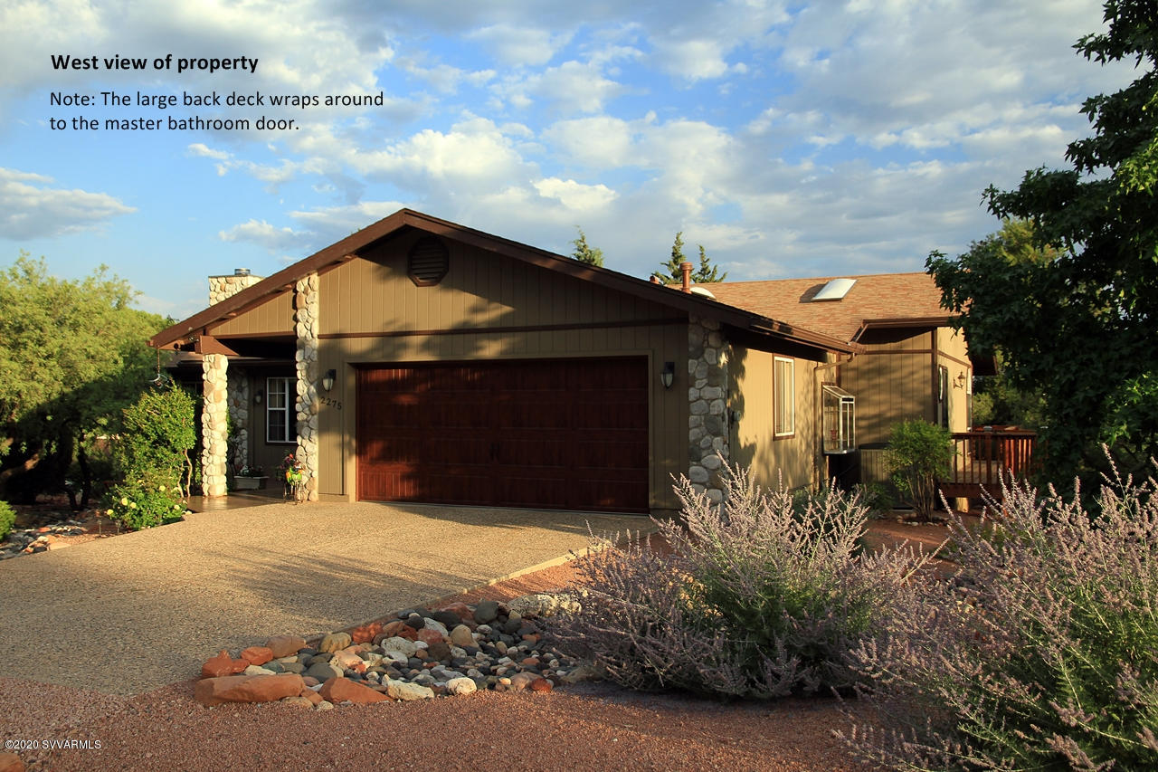 2275 Corral Road Sedona, AZ 86336 - Photo 3 of 30 a front view of a house with a garden