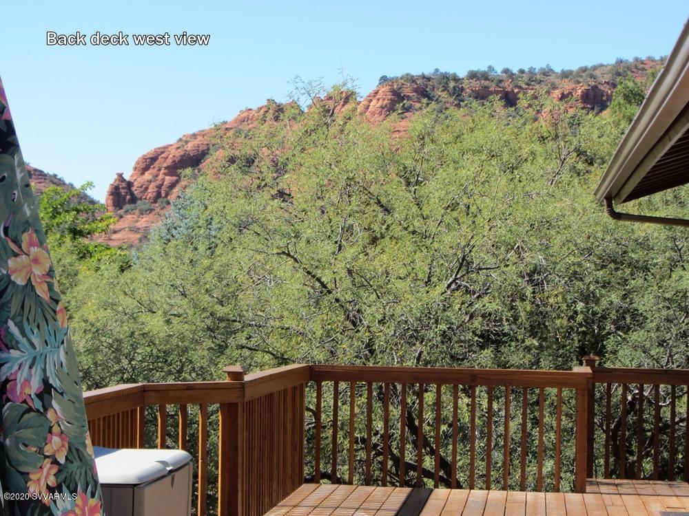 2275 Corral Road Sedona, AZ 86336 - Photo 5 of 30 a balcony with wooden floor and yard