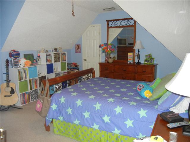 291 Laurel Crown Road Manchester, TN 37355 - Photo 20 of 20 a bedroom with a bed and a wooden floor