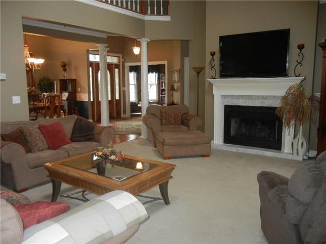 291 Laurel Crown Road Manchester, TN 37355 - Photo 6 of 20 a living room with furniture a flat screen tv and a fireplace