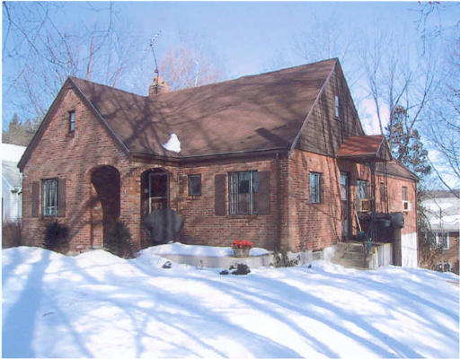 a view of a house with a snow in the yard