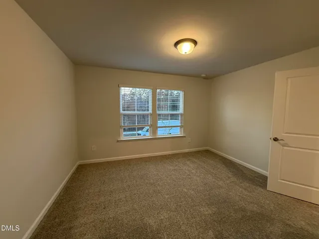 a view of a house with a iron gate