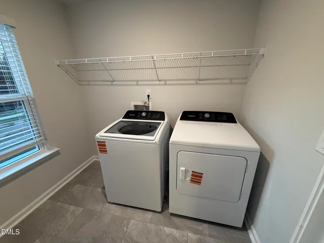 a view of a house with backyard porch and sitting area