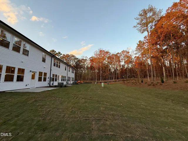 a big yard with large trees