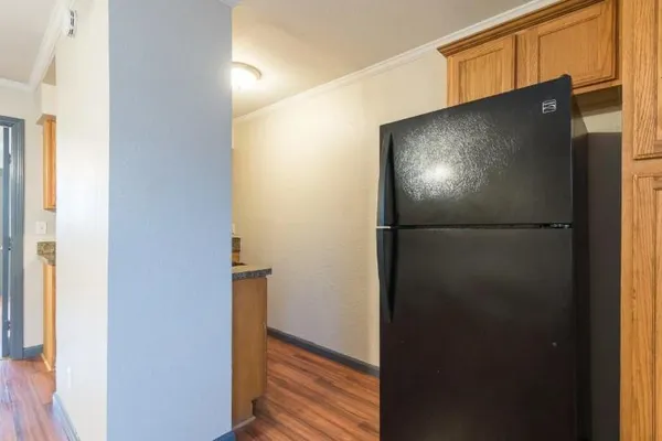 a view of a refrigerator in kitchen