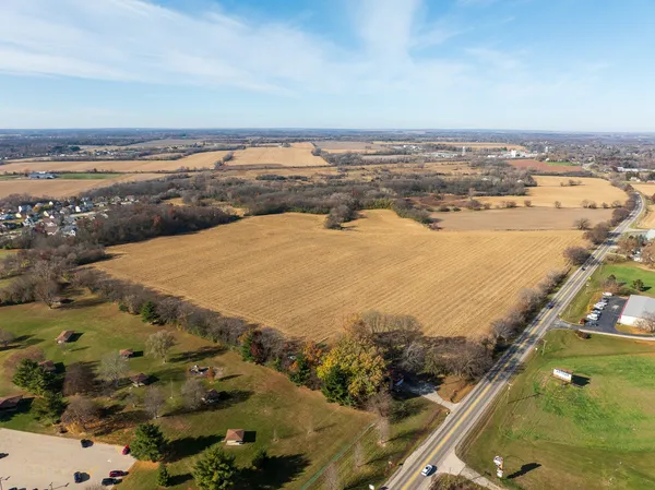 an aerial view of a residential houses with outdoor space