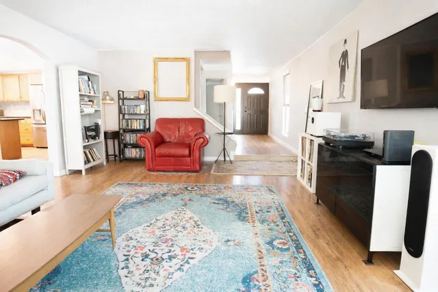 a living room with furniture and a flat screen tv