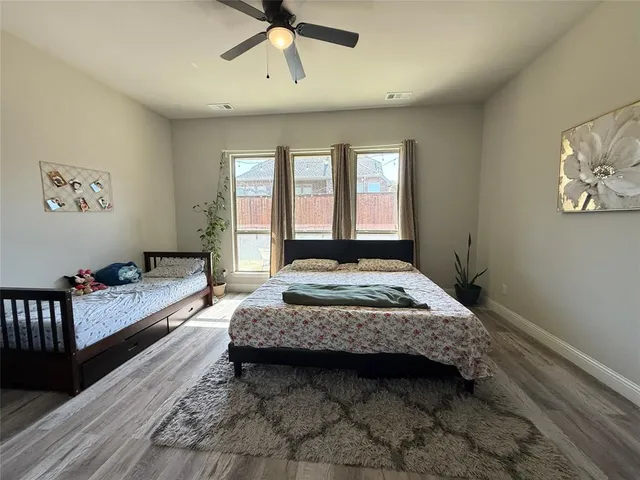 a bedroom with a bed and window