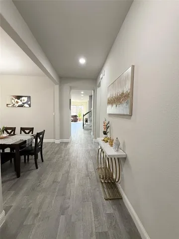 a room with furniture and wooden floor
