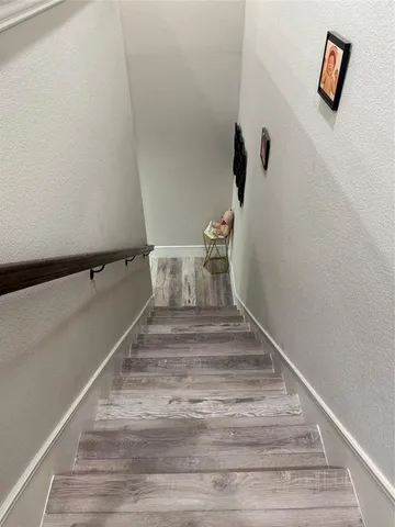 a view of staircase with white walls