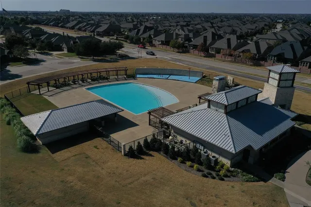 an aerial view of a house having patio
